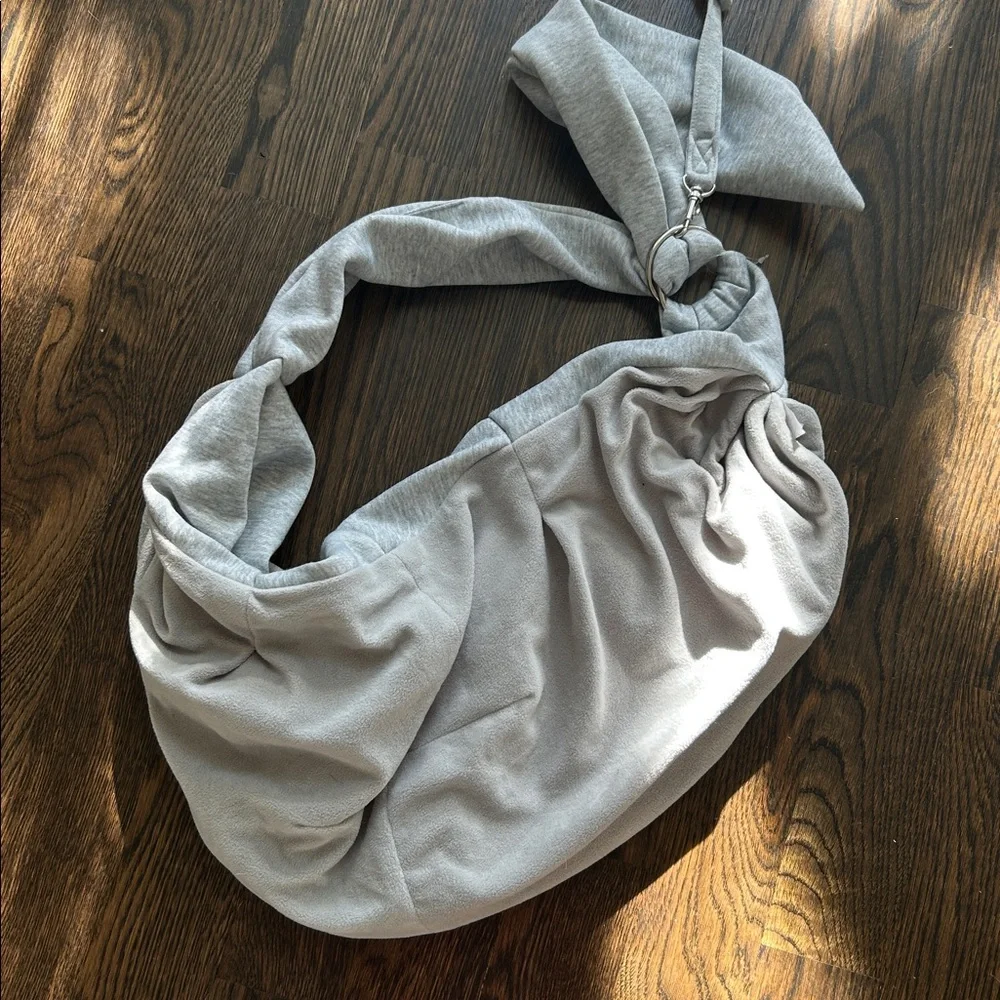 Gray dog sling carrier